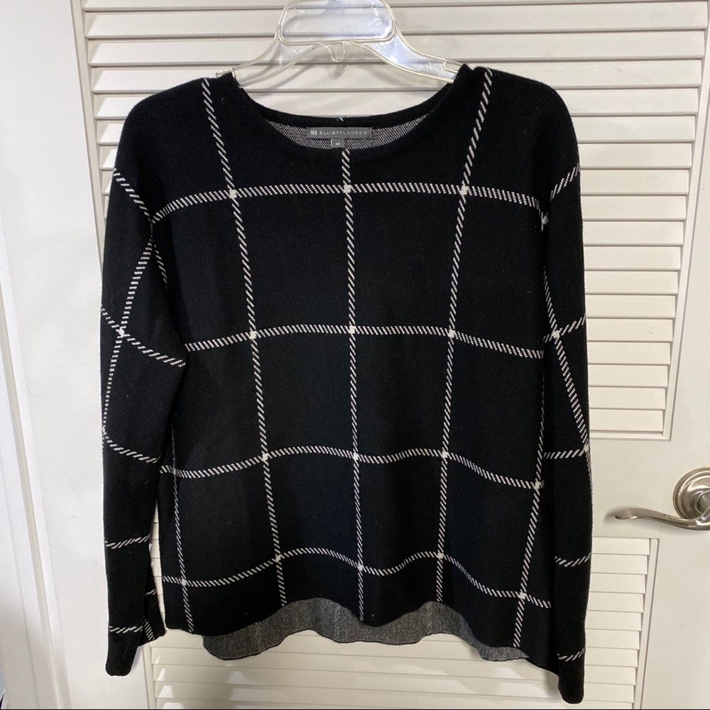 Black and white check pattern sweater.